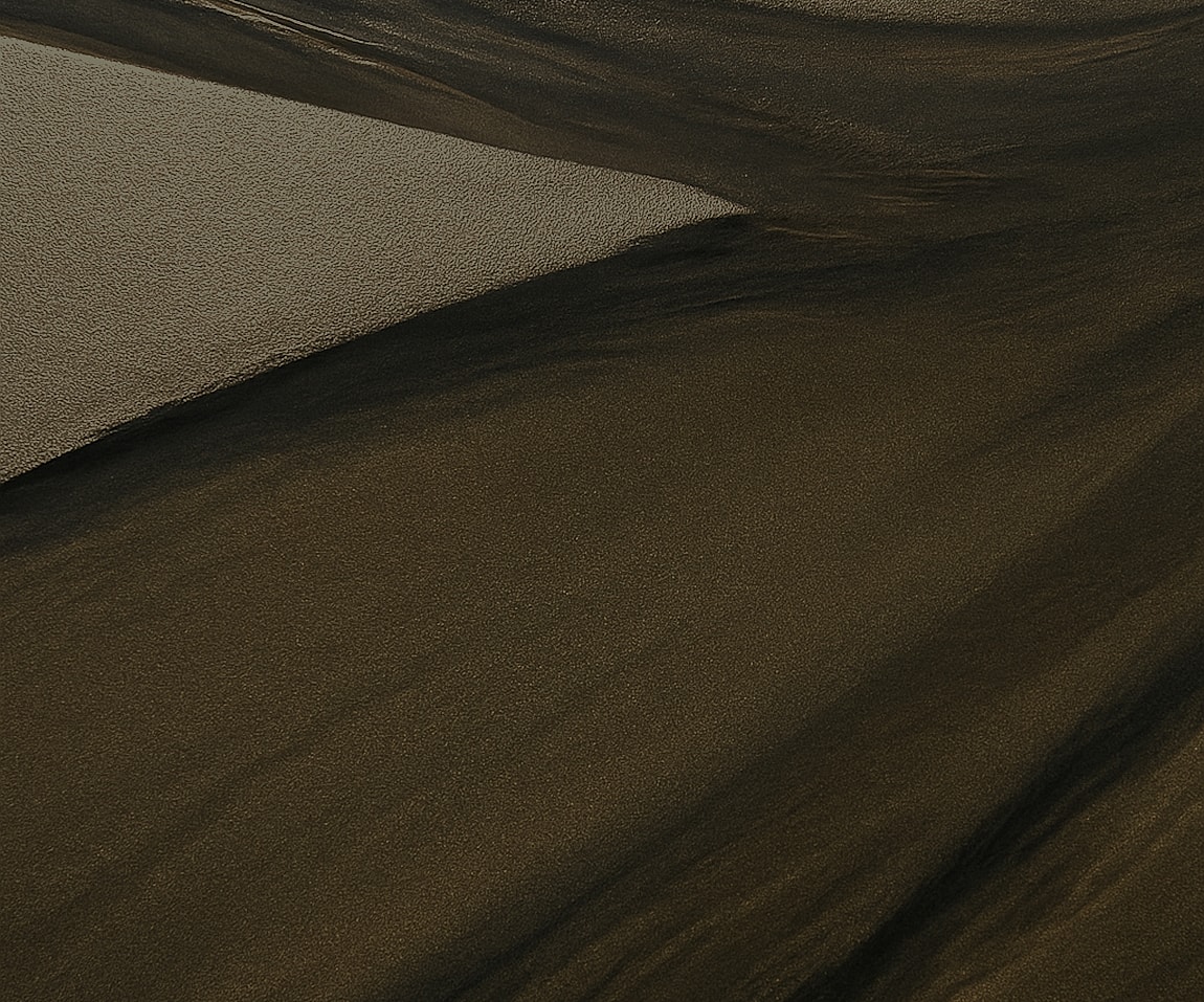 Textured sand patterns in natural earth tones.