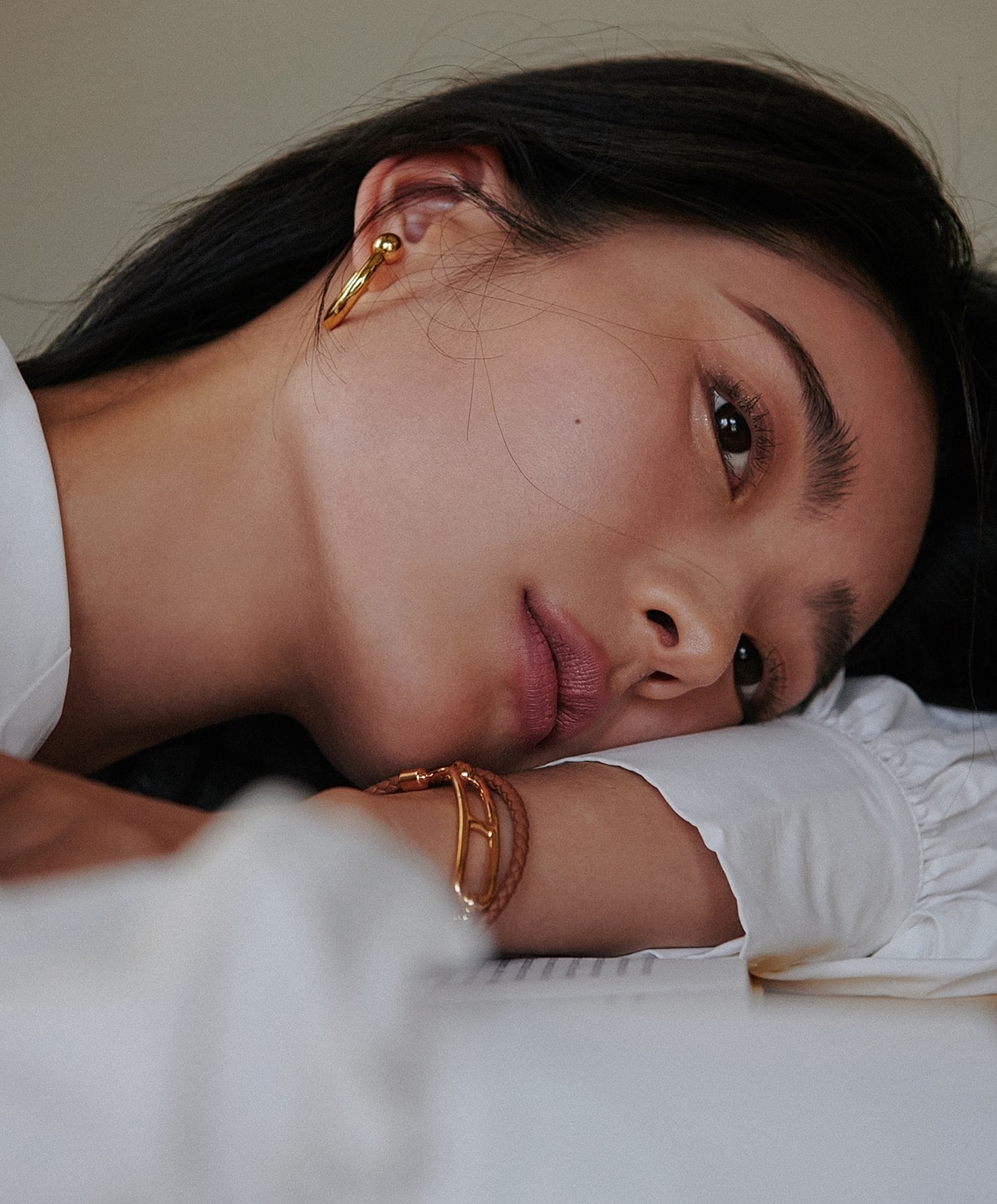 Close-up of a woman with elegant jewelry.